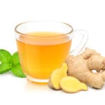 Glass,Cup,Of,Hot,Ginger,Tea,With,Ginger,Rhizome,(root)