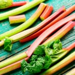 Fresh,Rhubarb,Stem,On,Retro,Wooden,Table.bundle,Of,Stalks,And
