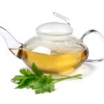 Glass,Teapot,With,Lovage,Tea,And,A,Fresh,Twig,Of