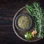 Fresh,And,Dried,Rosemary,With,Rosemary,Oil,On,The,Wooden