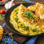 Herb,Omelette,With,Chives,And,Oregano,Sprinkled,With,Chili,Flakes,