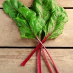Fresh,Swiss,Chard,On,Wooden,Table,,Close,Up