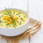 Corn,Soup,In,White,Bowl,On,White,Wooden,Background.copyspace