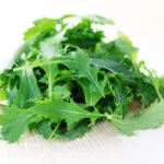 Pile,Of,Mizuna,Leaves,Ready,For,Salad,-,Fruits,And