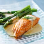 Salmon,Fillet,With,Asparagus,And,Yellow,Sauce,Closeup
